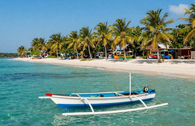 Cebu Philippines tropical beach with clear water and bangka boat for travel planning guide