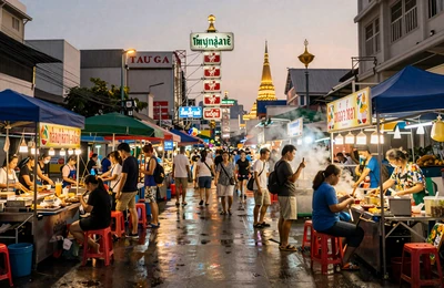 Bangkok Thailand street market at dusk with golden temple in background for first trip planning