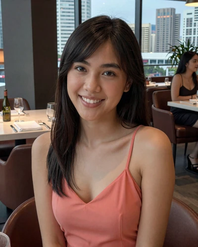 Grace, 24, Filipino woman from Manila at restaurant with city skyline seeking meaningful match